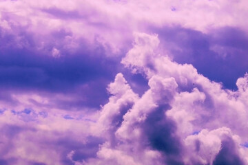 Beautiful pink storm clouds on a blue sky. Beauty of nature. Natural background.