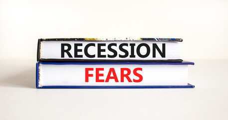 Recession fears symbol. Concept words Recession fears on books on a beautiful white table white background. Business and recession fears concept. Copy space.