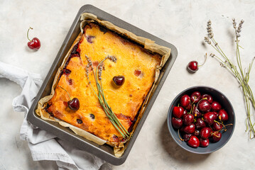 Fresh baked sweet cherry pie or red brownie cake in baking sheet with lavender, napkin and raw...