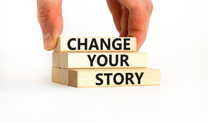 Change your story symbol. Concept words Change your story on wooden blocks on a beautiful white table white background. Businessman hand. Business finacial and change your story concept. Copy space.