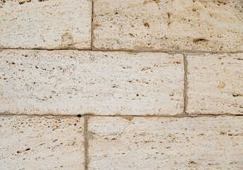 The texture of the stone is beige.Rock, decorative stone. Rough texture of the stone.