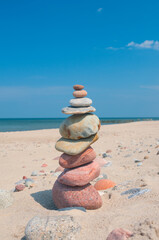 Stones stack balance tranquil concept on a coast line