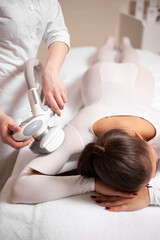 Obraz na płótnie Canvas Cropped photo of a massage and body care - woman getting spa massage treatment at beauty spa salon.