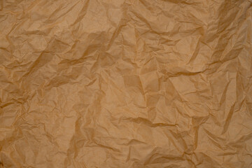 Fototapeta premium crumpled parchment paper. background from old paper. baking paper.
