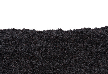 close-up texture of raw black rice with copy space for text.