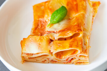 ziti pasta lasagna meat tomato sauce casserole fresh healthy meal food snack on the table copy space food background rustic