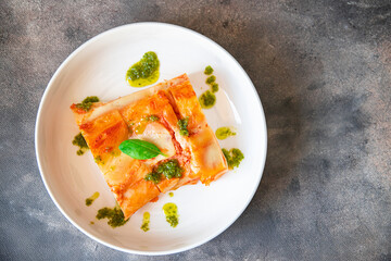 ziti pasta lasagna meat tomato sauce casserole fresh healthy meal food snack on the table copy space food background rustic