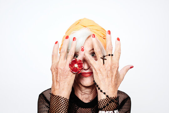 Stylish old lady hiding face