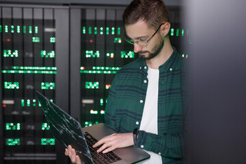 IT employee using laptop to browsing information 