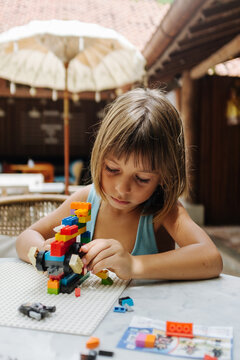 Child Playing With A Blocks
