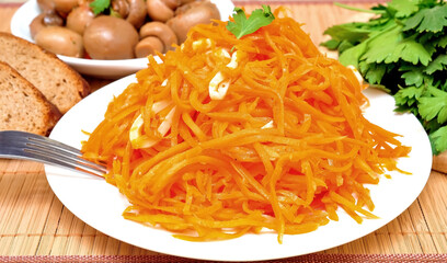 Korean carrots with squid and marinated champignons.