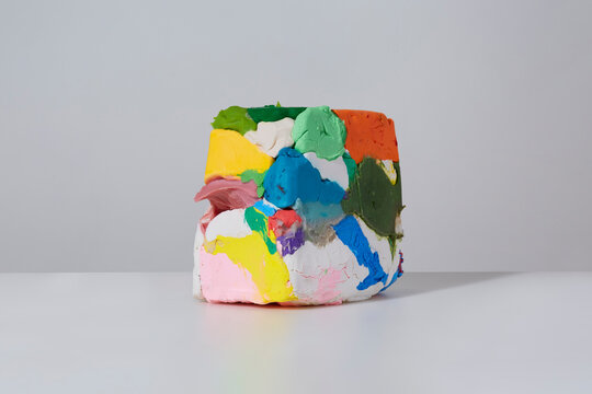 Large pile of colourful messy plasticine 