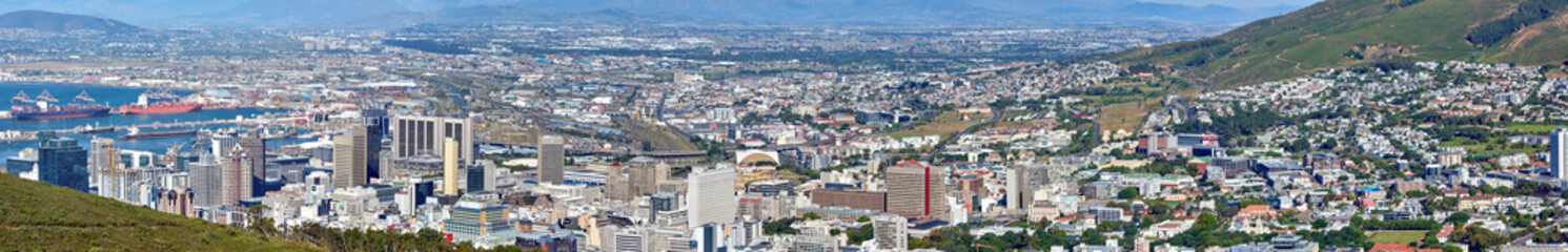 Fototapeta na wymiar Landscape view of the city Cape Town in South Africa. Wide screen and scenic view of an urban town with greenery and nature during summer. Banner of residential buildings in the Western Cape