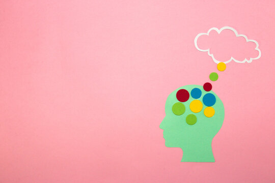 blue paper head with colorful dots leading to clouds as a space for copying, message, thinking, intelligent head, creative design, high cognitive abilities
