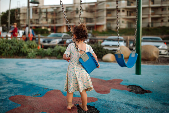 Back of girl standing at playground
