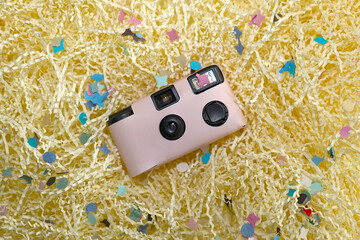 Pink disposable camera at party