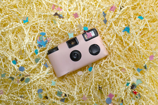 Pink disposable camera at party