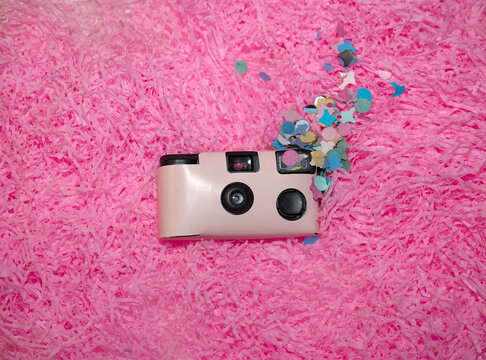 Pink disposable camera at party