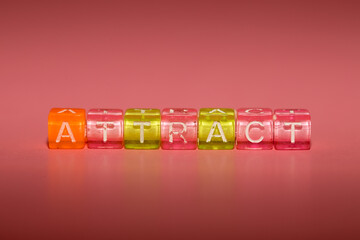 the word "attract" made up of cubes