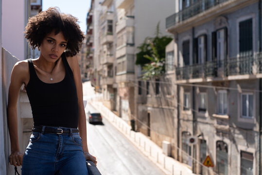 Portrait Of A Young Female Model With Afro hair On The Balcony
