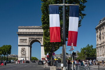 Arc de Triomphe in Paris with a French flag in France on the Champs Elysées