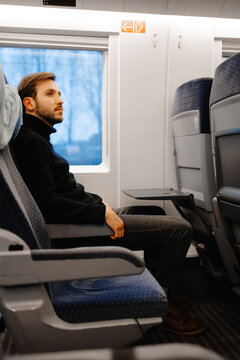 Male traveler using express train for trip