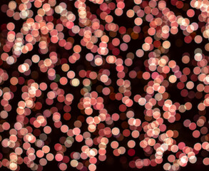 Medium size pink bokeh lights with orange, dark red, light, and dark pink, and rose gold.