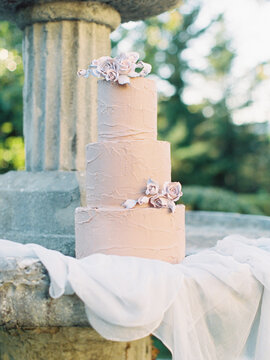 Pink Wedding Cake With Decorative Flowers 