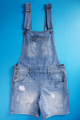 Blue jeans overall denim on blue background - 518379246