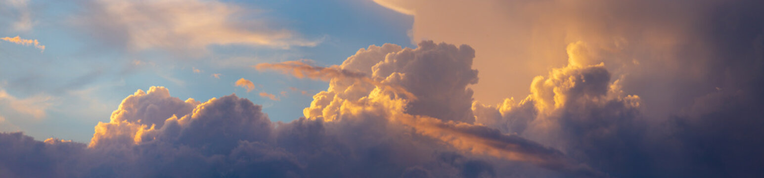 Sky panorama. Beautiful dramatic big clouds in the sky. Landscape of the power of heaven and nature. Copy space