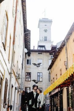 Man and woman admiring of town in courtyard