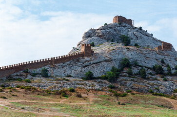 Ancient Genoese fortress on a mountain in the city of Sudak, Crimea 2021 August.