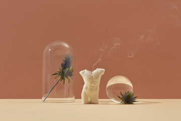 Extinguished male torso candle