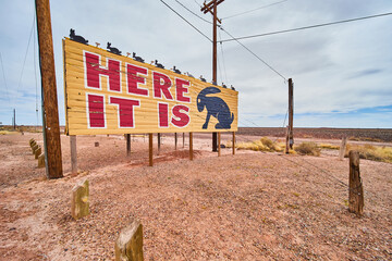 Wide angle of iconic here it is billboard with jack rabbit