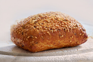 Food stuff. Closeup of freshly baked bread on a kitchen counter with copy space. Homemade wheat loaf ready to be sliced and served as a meal. Macro details of a seeded bun made fresh in a bakery.
