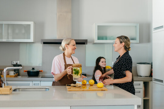 Family preparing lemonade kitchen