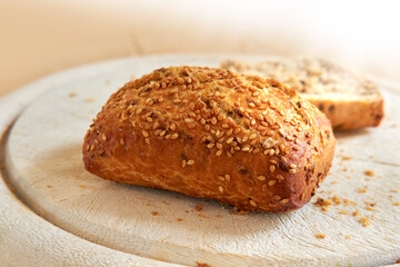 Closeup of freshly baked bread at a bakery with copy space. Zoom in on homemade rye loaves ready to be eaten and enjoyed as a delicious meal. Macro details of a fresh seed bun on display on a counter
