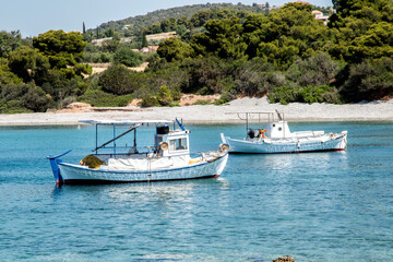 Naklejka na ściany i meble Fishing boats in small Mediterranean bay in sunny summer day