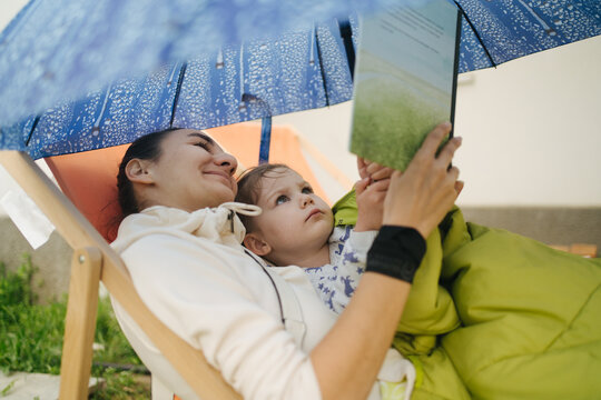 Woman and child reading a book