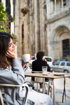 Woman in an outdoor cafe