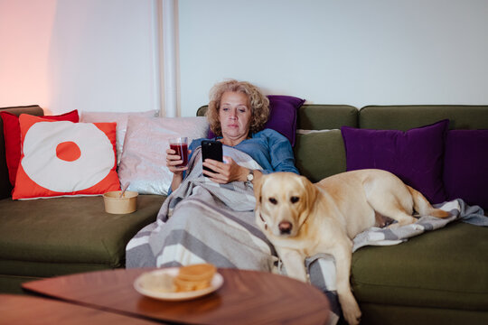 Woman at home using mobile phone