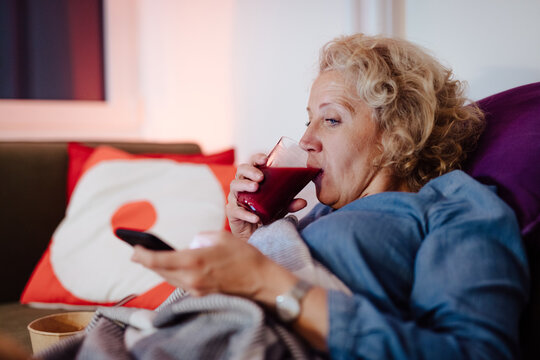 Woman at home using mobile phone