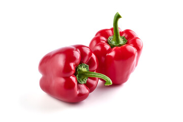 Red ripe bell peppers, isolated on white background.