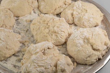 Dough in flour on a white background