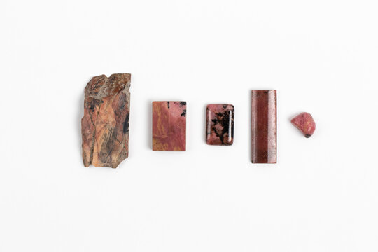 Rhodonite samples. Pink Manganese silicate mineral with an opaque transparency. Rough, cut and polished pieces