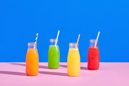 Four vegetable juices in glass bottles