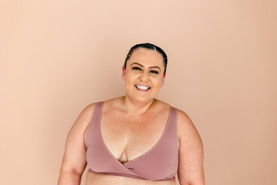 Smiling plus-size woman in bra