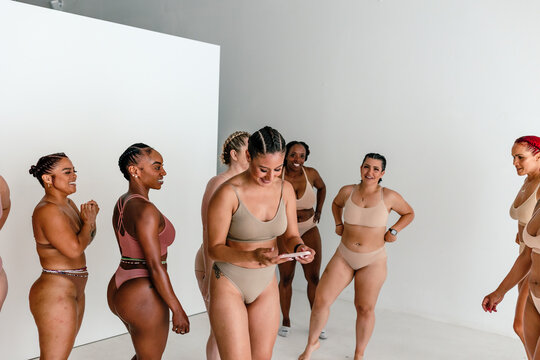 Happy females in studio in bras and panties