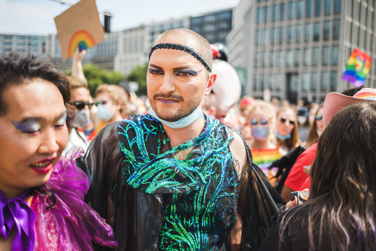 Friends walking in a crowd during Pride