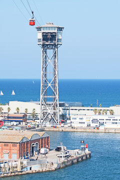 A cablecar crosses the port of Barcelona. Officially known as Transbordador Aeri del Port, it is commonly called the "Teleferico de Montjuic".
